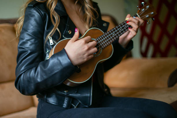 istock Young girl takes online classes to learn to play ukulele 1291070849