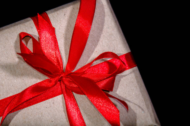 istock Christmas gift box with red bow. Black friday sale concept. 1291072002