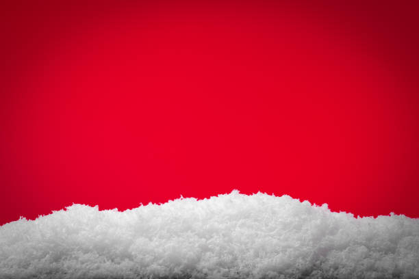 istock Festive red Christmas and snow background 1291072179