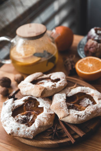 istock Fresh cookies with fruit orange jelly and mint on plate 1291075244