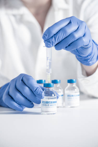 istock Doctor preparing COVID-19 coronavirus vaccine 1291076781