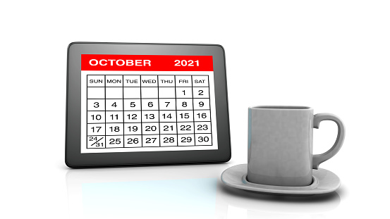 October 2021 calendar on Tablet PC and Coffee Cup