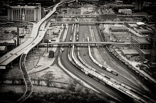 Dallas, USA - November 6, 2023: aerial of rails,bridge and parking lot in late afternoon in Dallas, Texas, USA