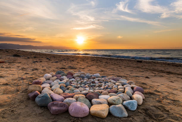 Stones Spiritual Ritual Ceremonial A Group of Stones Are Arranged on the Beach in a Ceremonial Ritualistic Pattern summer solstice stock pictures, royalty-free photos & images
