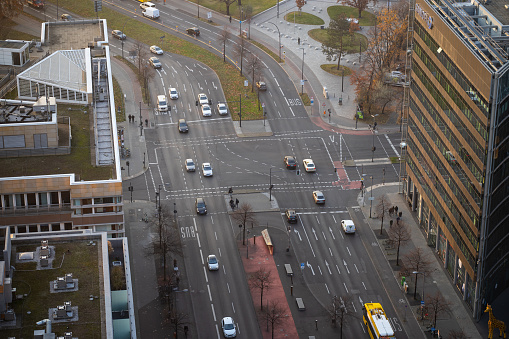 Large road crossing seen from an aerial view as cars and bus driving through