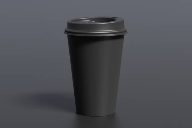 istock Black take away coffee paper cup mock up with black lid on black background. 1291078758