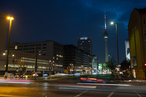 Light trails visible at a Berlin crossing in front of the famous TV tower fernsehturm