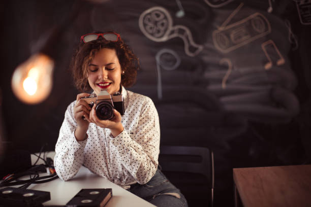 istock Retro female photographer 1291083838