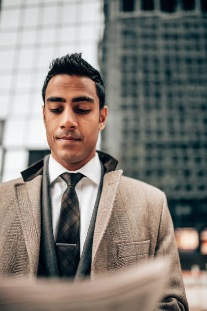 istock indian business man reading newspaper in manhattan 1291086138