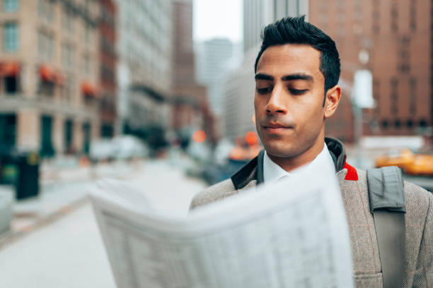 istock indian business man reading newspaper in manhattan 1291086197