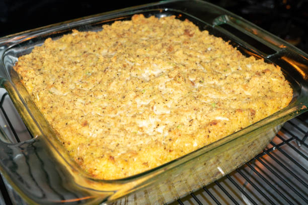Cornbread Dressing Cornbread Dressing in a Tempered Glass Baking Dish thanksgiving full stock pictures, royalty-free photos & images