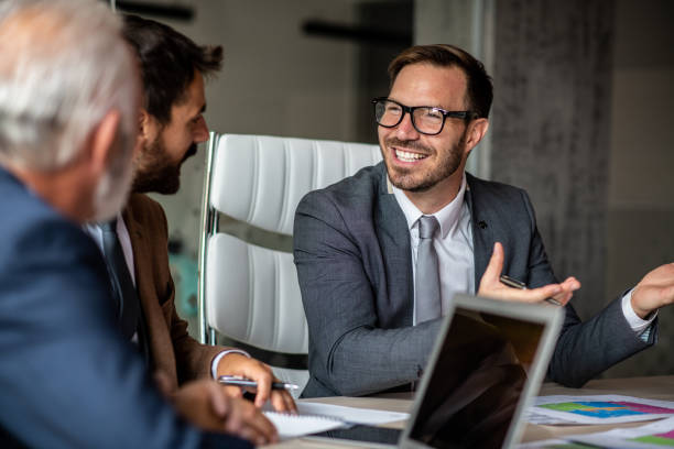 istock Junior businessman on meeting with his bosses. 1291086473