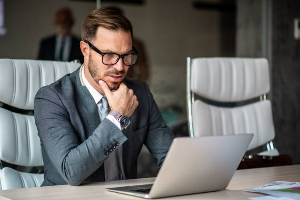 istock Young businessman thinking about new strategy. 1291088537