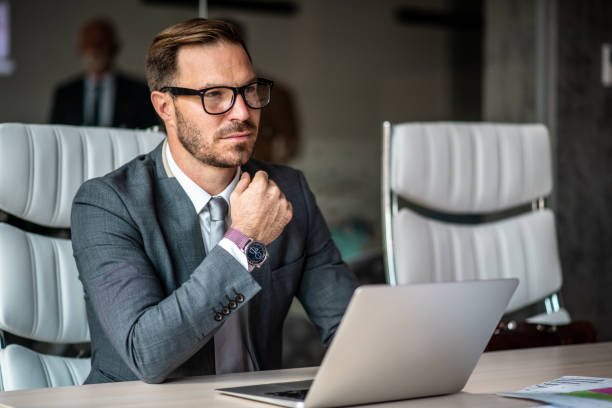 istock Junior businessman thinking, concentrated on his job. 1291088548