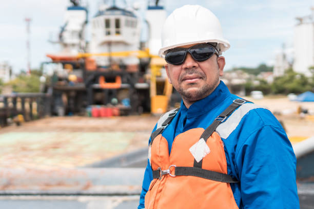 istock Hispanic sea going marine deck officer, with PPE personal protective equipment - hull, covered 1291090907