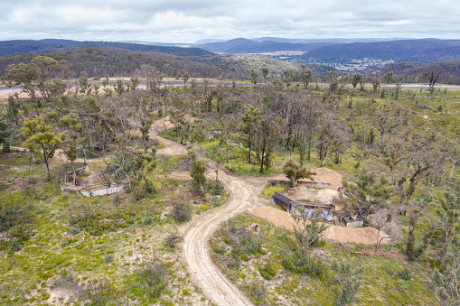 Aerial photograph of a dirt track and forest regeneration after bushfires near Clarence in the Central Tablelands in regional New South Wales in Australia