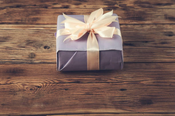 istock gift box on the wooden table 1291094092