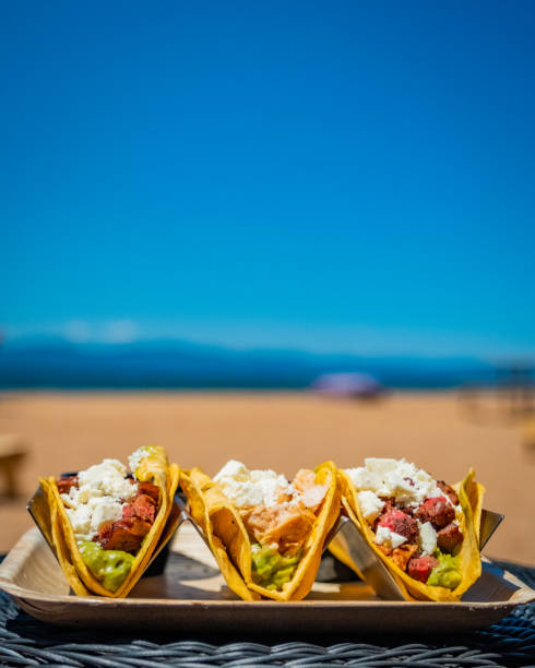 trío de tacos en la playa - legume small group of objects nobody color image fotografías e imágenes de stock