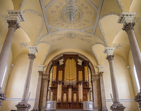 A beautiful chapel in Waterford, Ireland. A beautiful organ and rows of ornate pillars and pews adorn the interior of this sacred space.