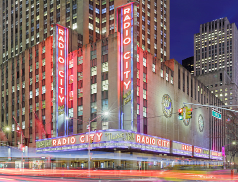 New York City, USA - January 28, 2020: Night time view of the Radio City Music Hall located in Rockefeller Center. Nicknamed “the Showplace of the Nation”, It is one of the largest theaters in the country and a major tourist destination in the New York City.