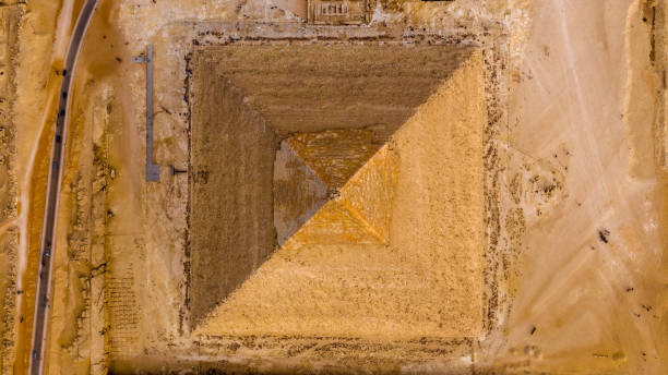 Aerial Vertical view of the pyramid of King Khafre, Giza pyramids landscape. historical egypt pyramids shot by drone. Aerial Vertical view of the pyramid of King Khafre, Giza pyramids landscape. historical egypt pyramids shot by drone. kheops pyramid photos stock pictures, royalty-free photos & images