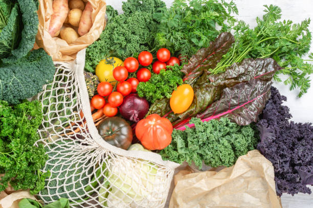 istock Variety of organic vegetables on white table 1291101604