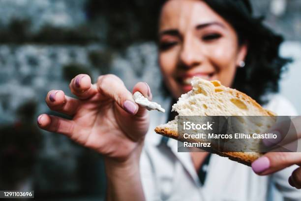 Mexican Woman Eating Rosca De Reyes Or Epiphany Cake Roscon De Reyes With Traditional Mexican Chocolate Cup Stock Photo - Download Image Now