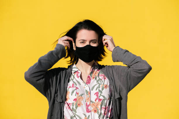 istock young girl wearing protective mask 1291104698