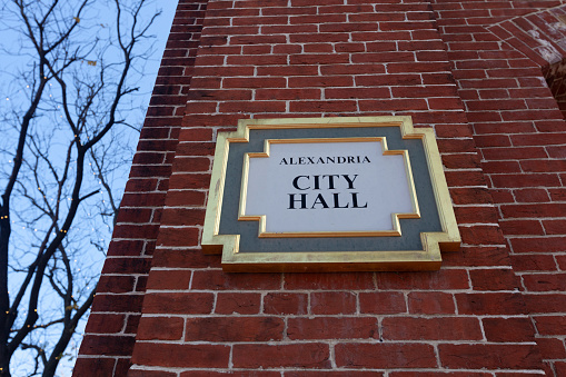 Alexandria, Virginia, USA 11-28-2020: Historic 18th century brick building that serves as the City Hall of Alexandria, Virginia.