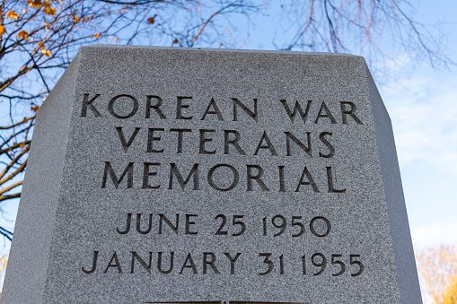 Frederick, MD, USA  11-23-2020: Korean War Veterans Memorial located at the Memorial park in Frederick. This granite stone is among many monuments in this historic park