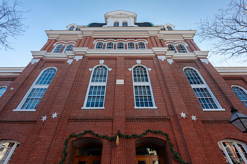 Alexandria, VA, USA 11-28-2020: Historic brick building that serves as the City Hall of Alexandria, Virginia. Built in 1749 originally as Market Place and then used as court, after renovations in 1817 it has been used as City Hall.