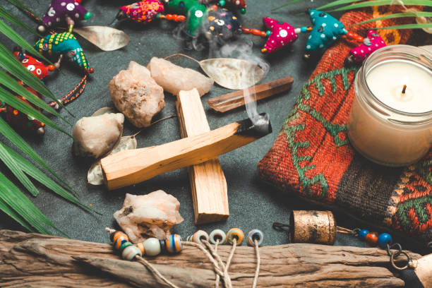 istock Burning palo santo background with crystals and gemstones. Cleansing bundle with healing minerals and candles. Relax and zen flat lay 1291110364