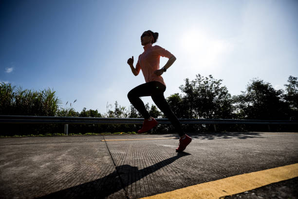 istock Female runner running on mountain top on winter day 1291112512