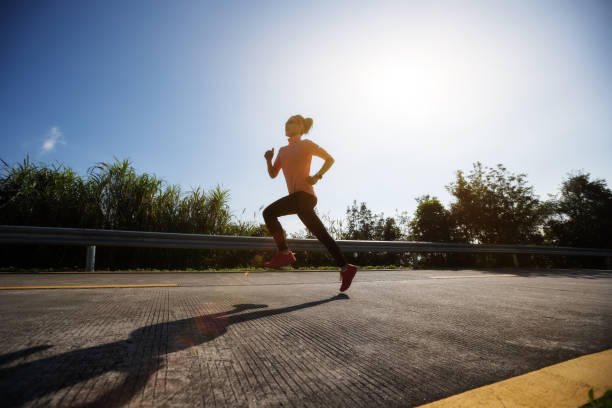 istock Female runner running on mountain top on winter day 1291113211
