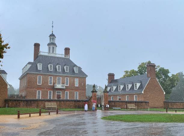 Governor's Palace in Heavy Rain in Williamsburg, Virginia, USA Williamsburg, VA, USA - September 29, 2020: A rainy day view of the Governor's Palace, the home for the Royal Governors in Williamsburg, Virginia, USA. governor's palace williamsburg stock pictures, royalty-free photos & images