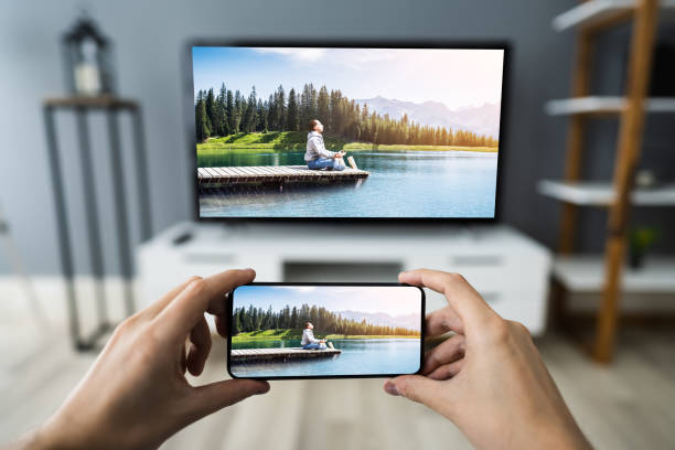 istock Man Watching TV Streaming From Smartphone 1291113922