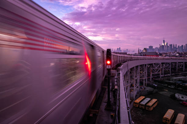 Speeding F Train The F Train speeds out of Smith 9TH Street subway station in Brooklyn, NY. USA. railway signal stock pictures, royalty-free photos & images