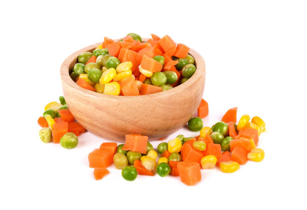 istock Mix of vegetable containing carrots, peas, and corn on white background 1291121932
