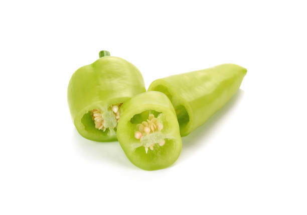 istock Sliced green chili peppers on a white background 1291122636
