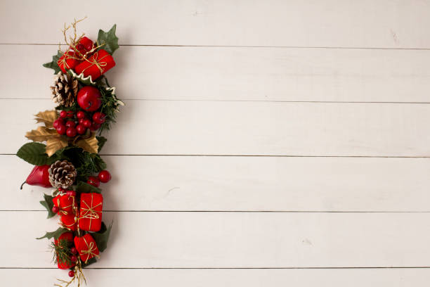 istock Interesting beautiful Christmas ornament decorations on white colored wooden surface texture with copy space. 1291124437