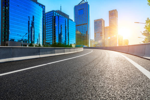 istock Empty asphalt road and modern cityscape in Beijing at sunset. 1291126061