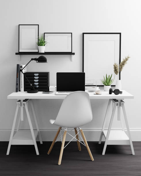 istock Home Office with laptop and photo frames 1291129667
