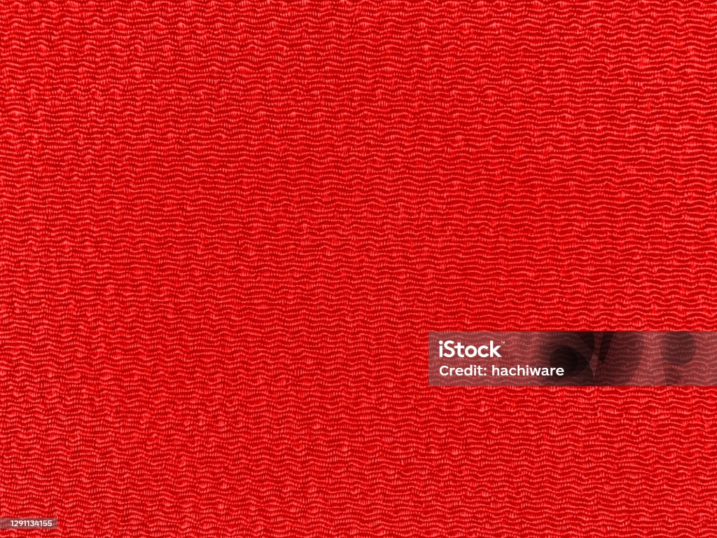 Background photo of red crepe (Tango Chirimen). Close up of Red crepe from above. Tango Chirimen is a textile from the Tango region of Japan. Crepe - Textile Stock Photo