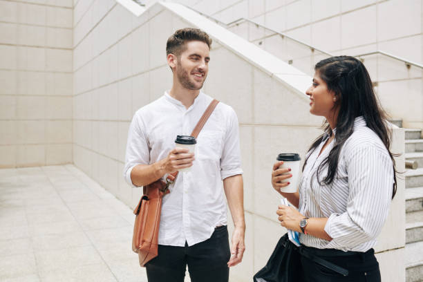 istock Business people with coffee cups 1291134632