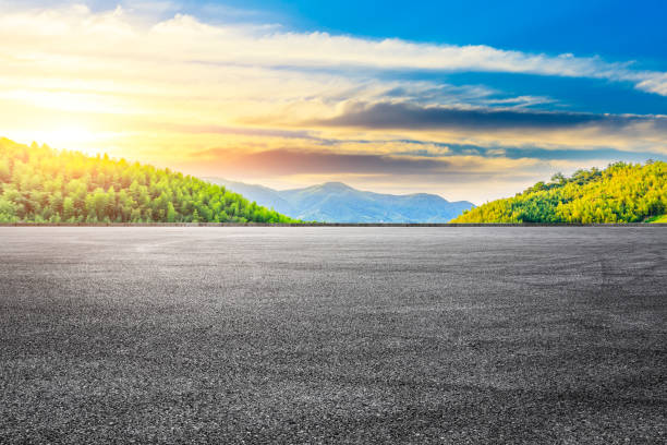 istock Asphalt road and green mountain with bamboo forest landscape. 1291136489