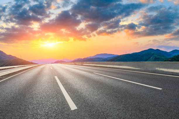 istock Asphalt road and mountain natural landscape at sunset. 1291137702