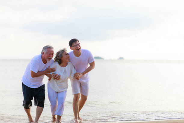 istock Happy family walking relax on the beach. 1291138842