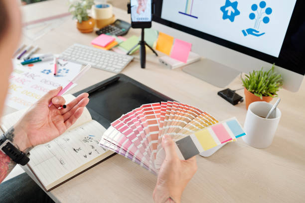 istock Designer and customer choosing color 1291139074
