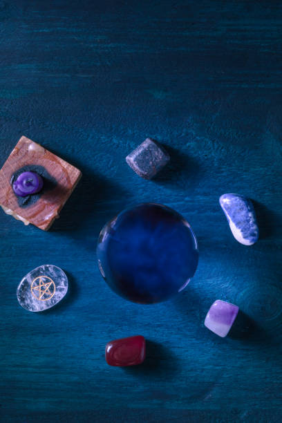 istock Fortune telling. A magic ball, overhead flat lay shot with crystals and a candle 1291139146