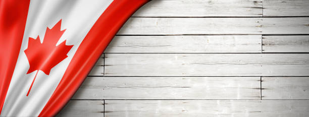istock Canadian flag on old white wall banner 1291142172